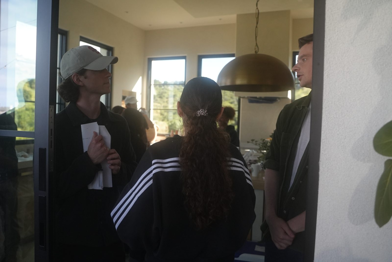 Charles with the cast between setups