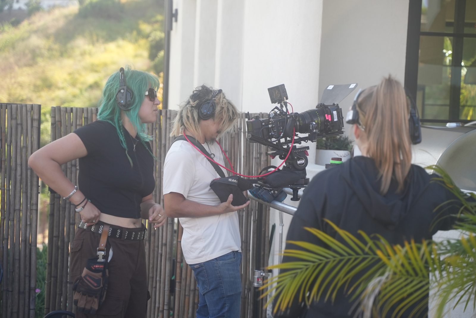 Camera team setting up outside the house
